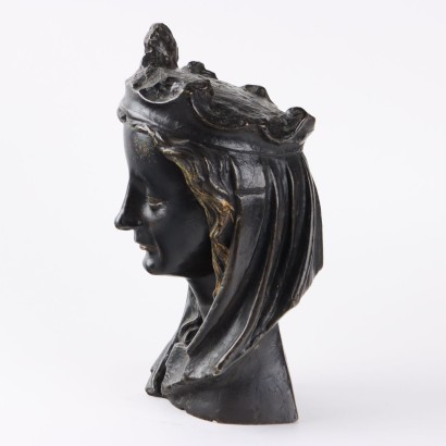 Female Face in Bronze